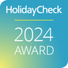 HolidayCheck 2024 Award Logo für das Hotel Schneider