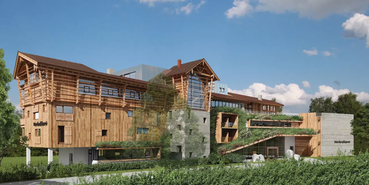 Moderne Holzarchitektur des Wellnesshotels WERDENFELSEREI mit begrünten Dächern und natürlicher Umgebung unter blauem Himmel.