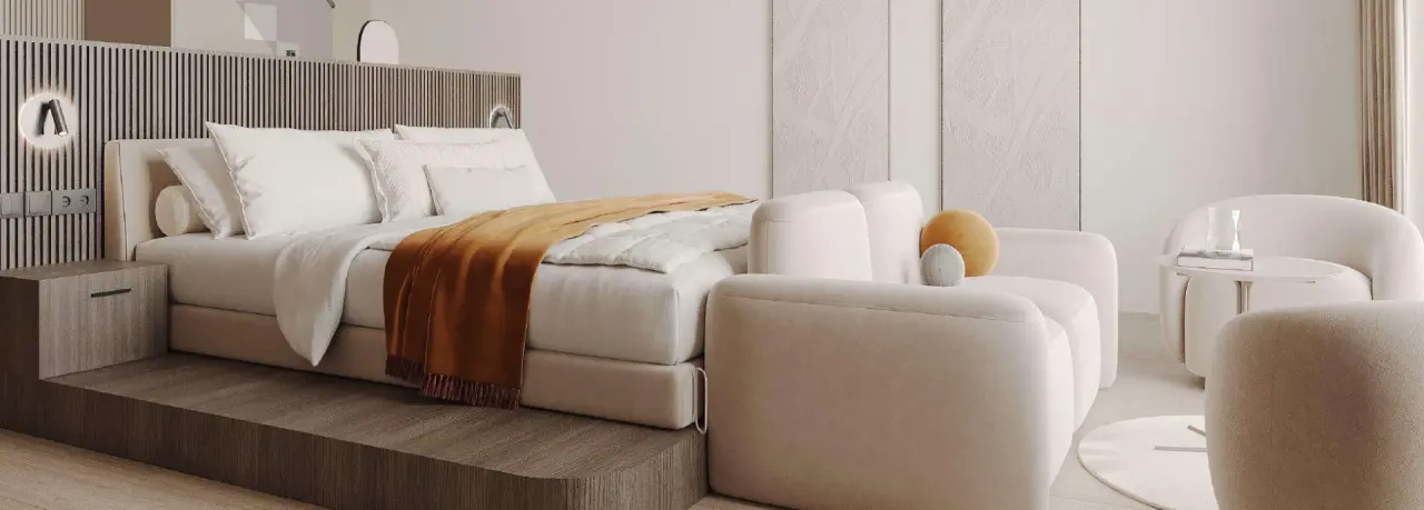 Modernes und stilvolles Hotelzimmer mit Doppelbett und Sitzbereich im Bayside Hotel.