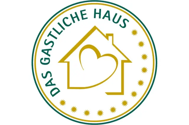 Logo 'Das Gastliche Haus' mit Haus- und Herzsymbol in Gold und Grün für das Romantik Hotel Landschloss Fasanerie.
