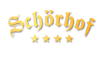 Logo des 4-Sterne Hotels Schörhof mit goldener Schrift und vier Sternen