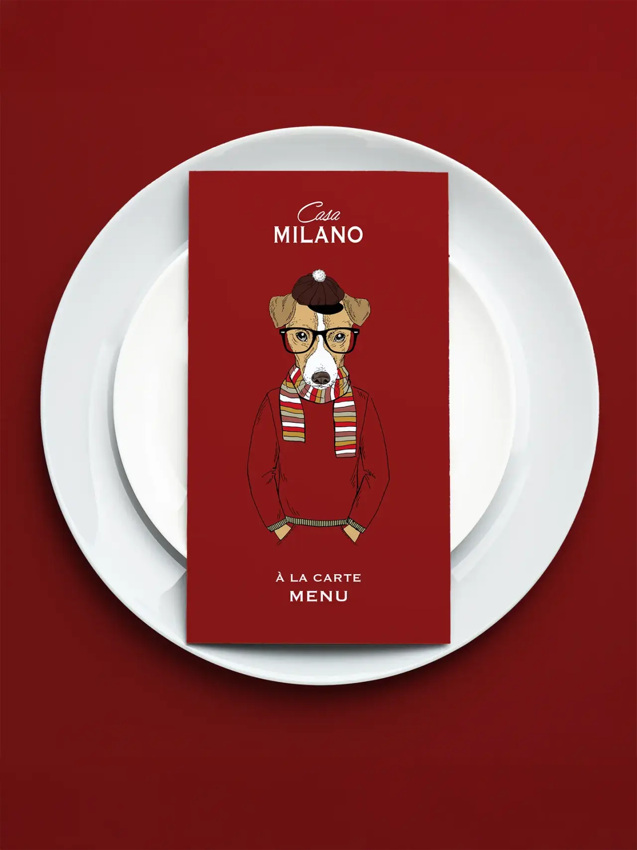 Menükarte des Restaurants Casa Milano im Resort Collina d'oro mit stilvoller Illustration eines Hundes auf rotem Hintergrund.
