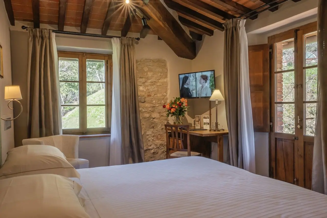 L'Ultimo Mulino Wellness Country Hotel in Gaiole in Chianti – Rustikales Zimmer mit Holzbalken | Wellnesshotel Toskana