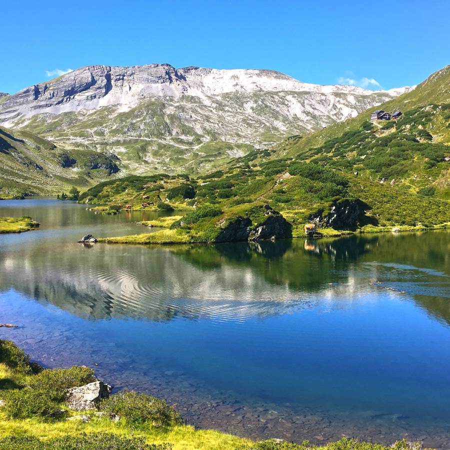Hotel Schütterhof in Schladming – Malerischer Bergsee mit Spiegelung der Alpen | Wellnesshotel Steiermark