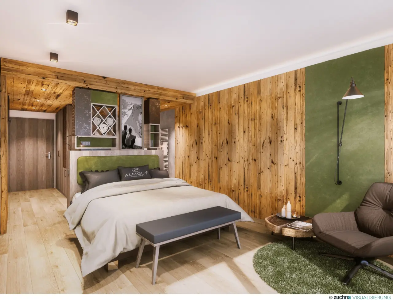 Gemütliches Doppelzimmer im ALMGUT Mountain Wellness Hotel mit Holzelementen, grünem Kopfteil und Lesesessel.